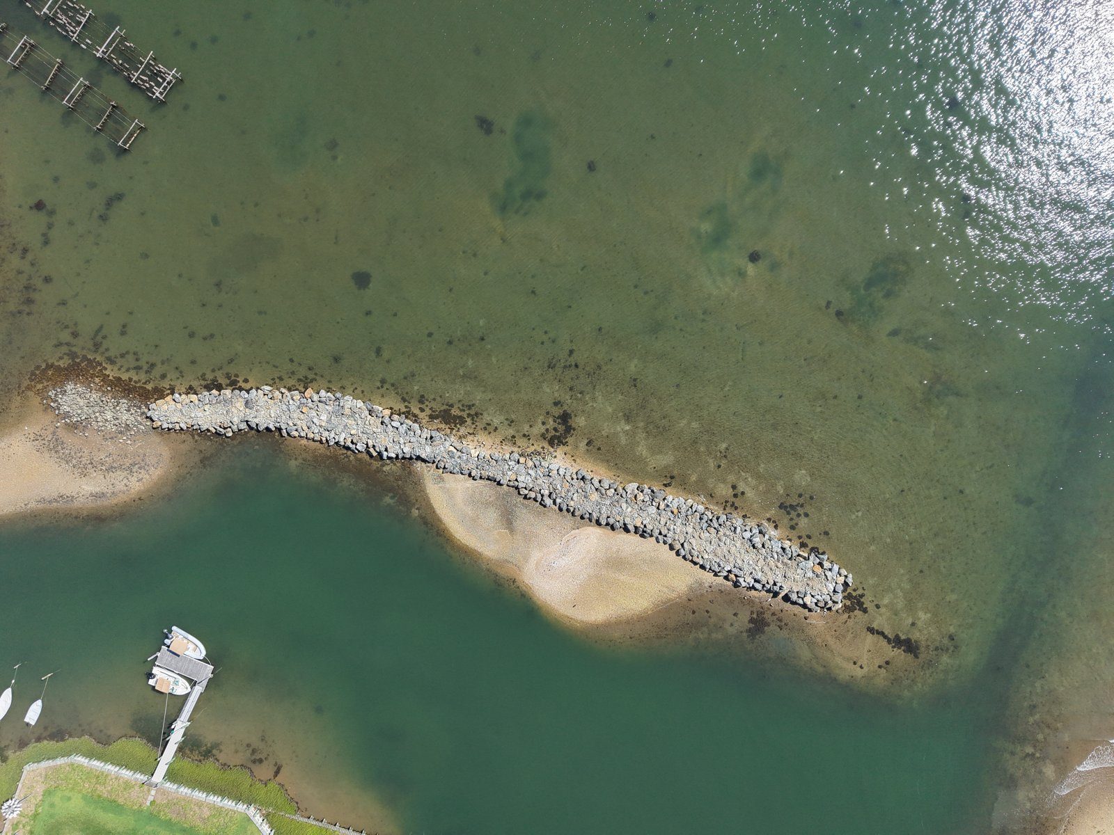 Aerial drone photo of the rebuilt rock jetty at Widow's Hole, August 2026