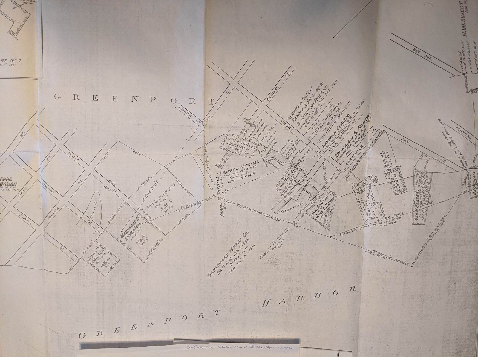 Nineteenth-century atlas map of Greenport village with property owners' names along the harbor