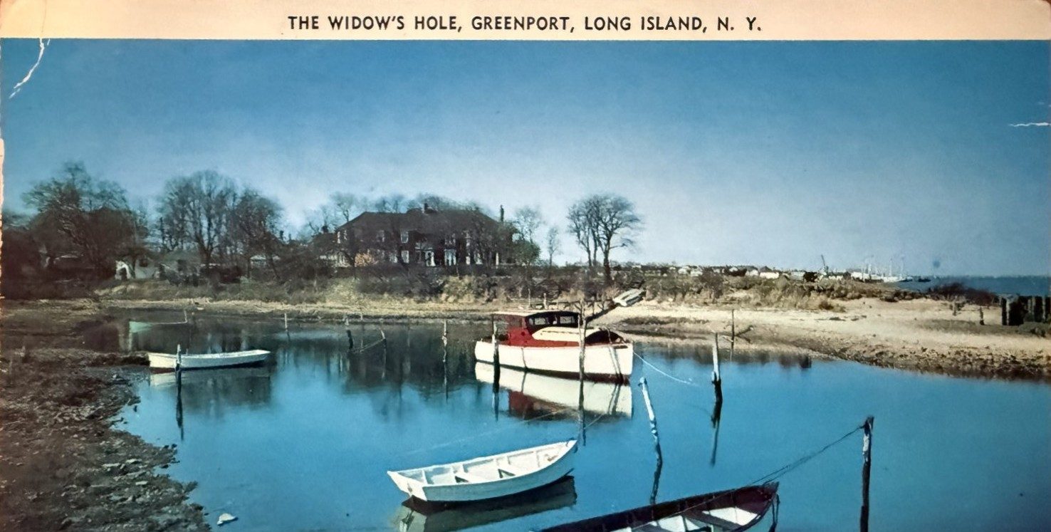 1950s color postcard: a large cruiser moored off the old captain's house at Widow's Hole in winter