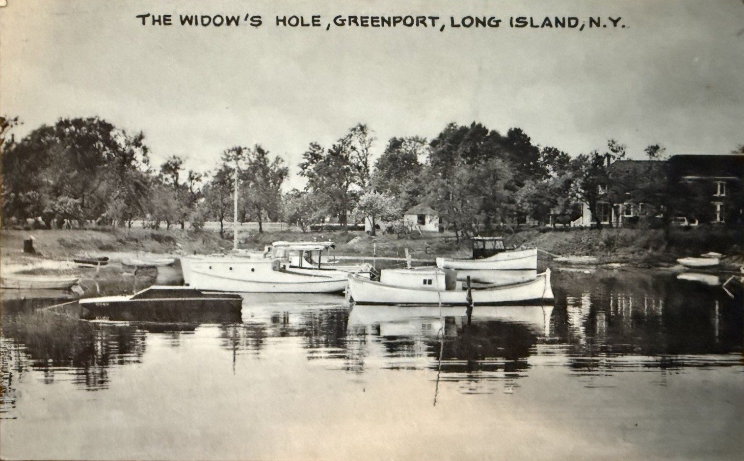 Postcard: cabin launches lying to their stakes at Widow's Hole